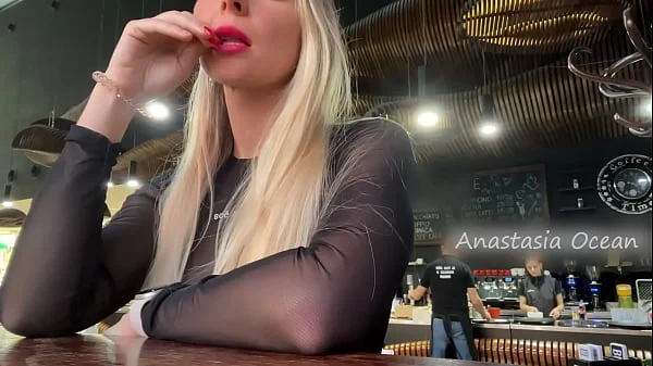 Public - Sexy blonde flashes her big natural tits in a crowded cafe.