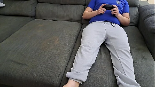 Stepsister sucks stepbrother and eats his sperm while he plays video games