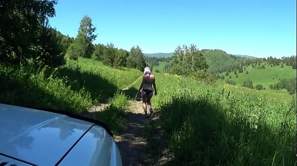 Voyeur from the car watching the juicy PAWG in panties. Amateur fetish with spying on a slender milf in a swimsuit outdoors on a public road.